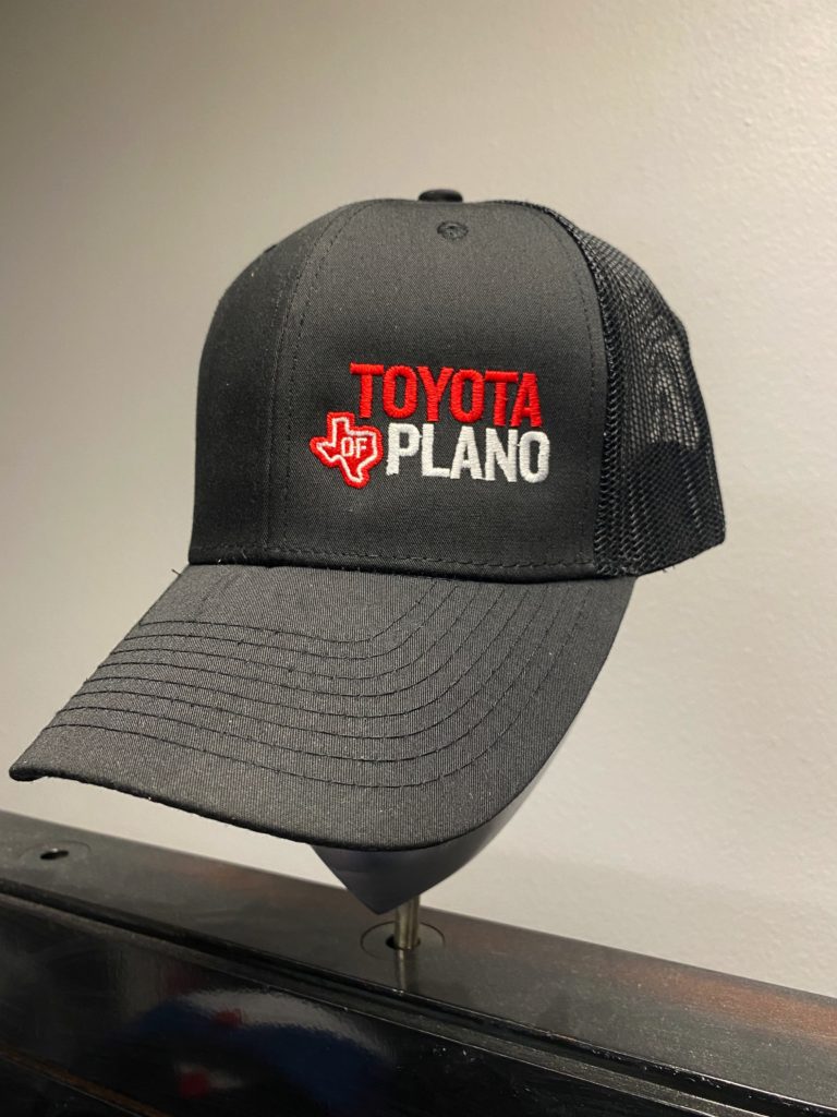 black hat with toyota of plano embroidered logo on it.